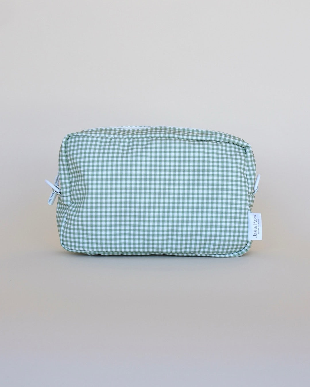 Bolsa neceser a cuadros verdes en fondo beige