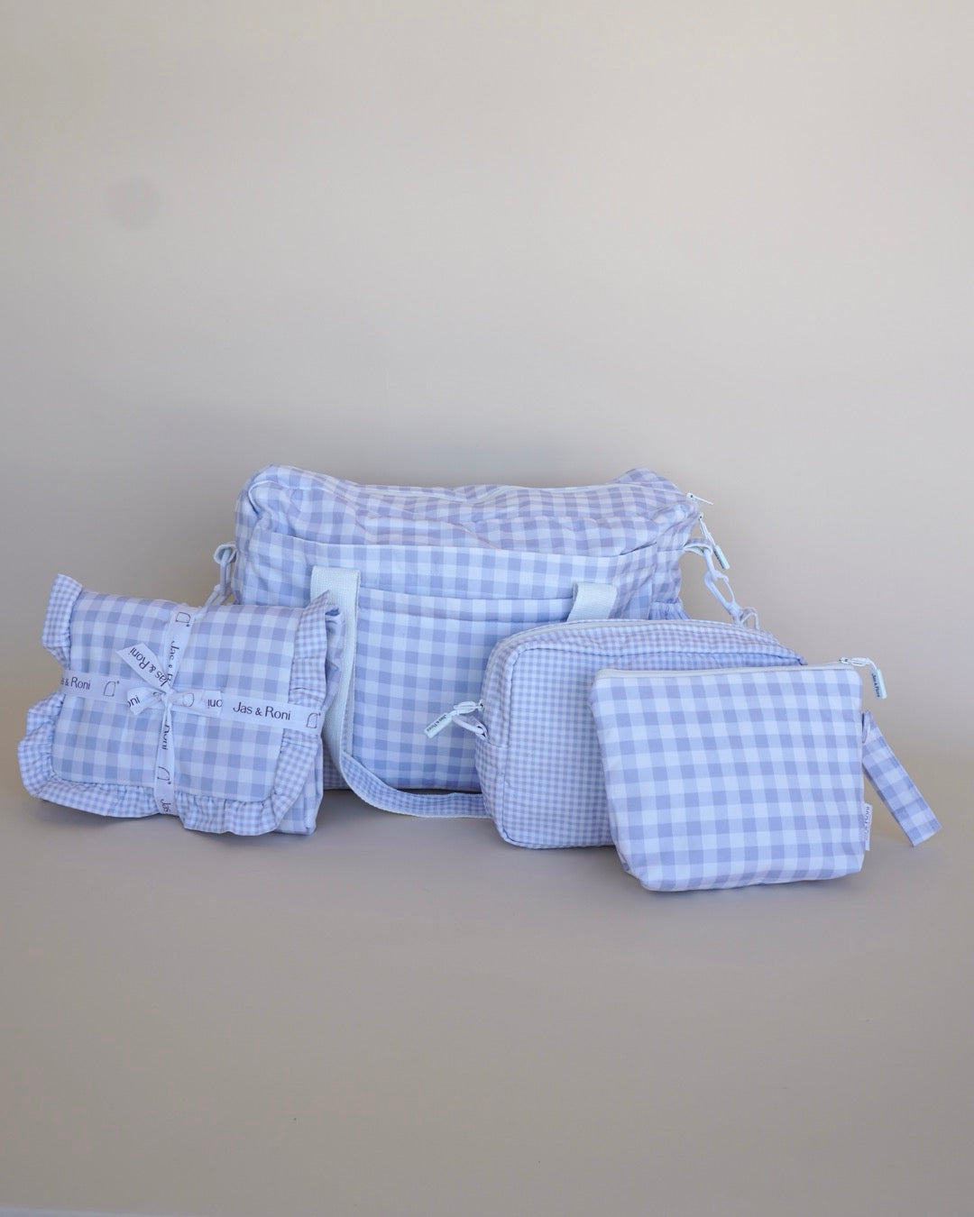 Pañalera, cambiador, neceser y bolsita colgable