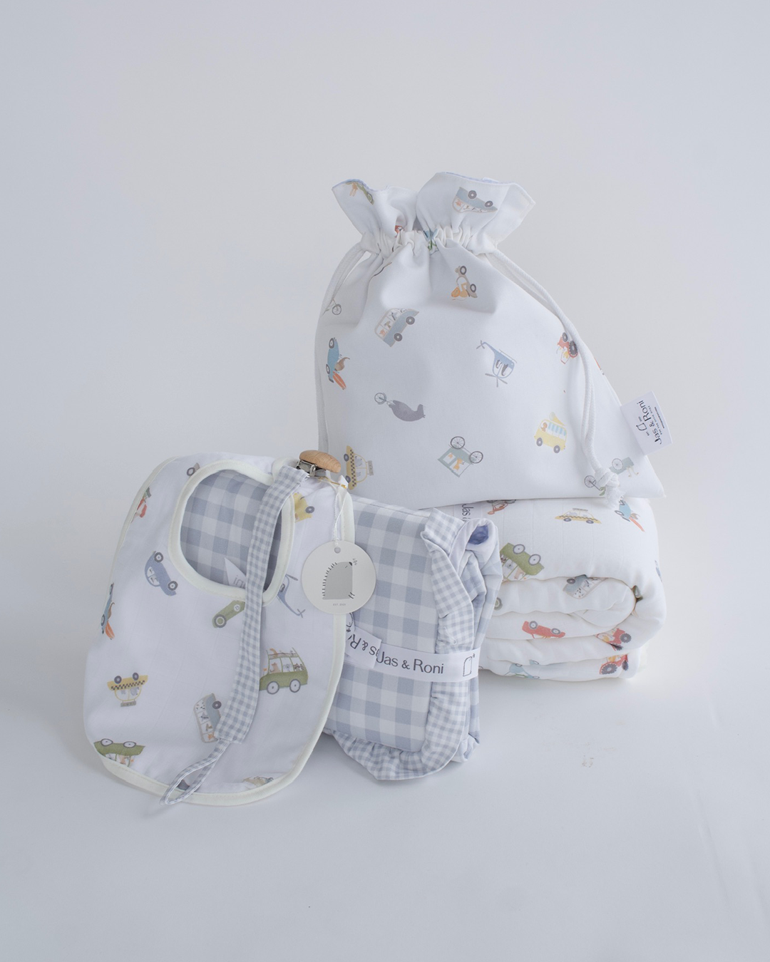 Cobijita de borreguito, cambiador, bolsita Jas&Roni, babero y porta chupón